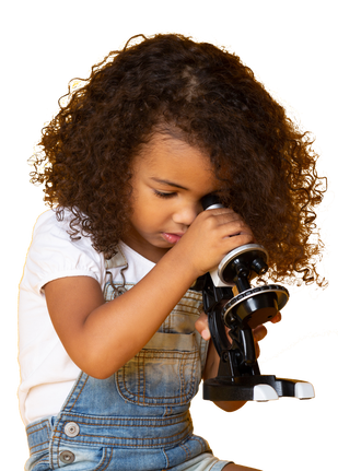 Young child looking through a microscope